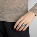 Black silver ring of modern design with circle of gold