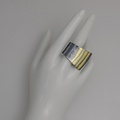 Silver ring with gold inlay in curved shape