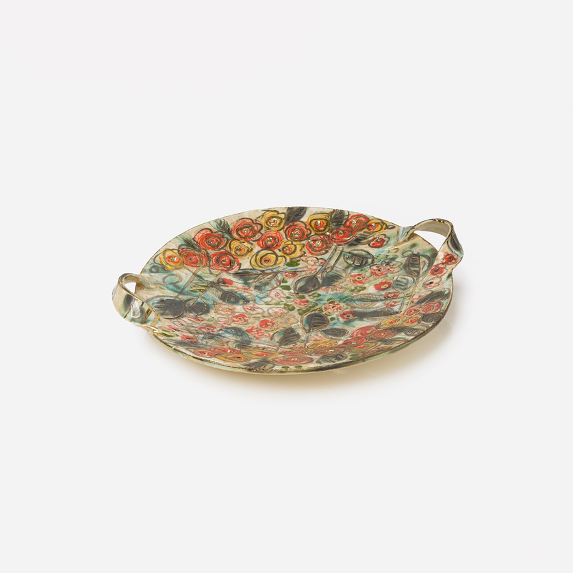 Round ceramic platter with handles and painted flower design