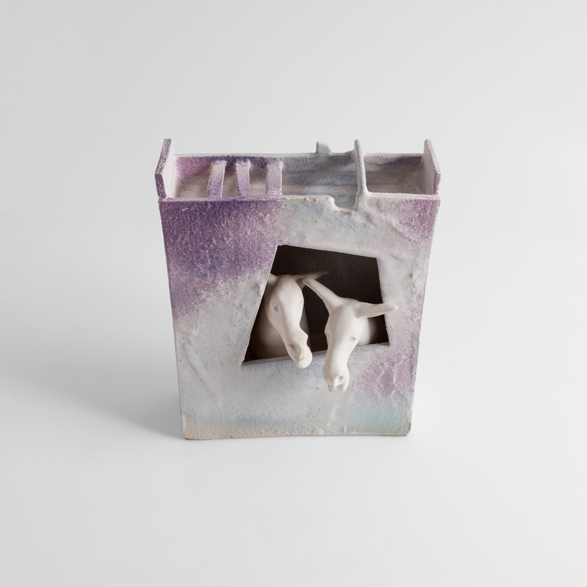 Decorative ceramic composition featuring donkeys