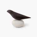 Little ceramic bird on an oval base
