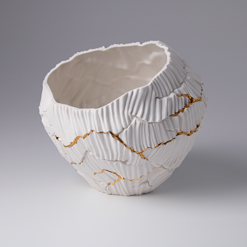 Low porcelain form with gold accents