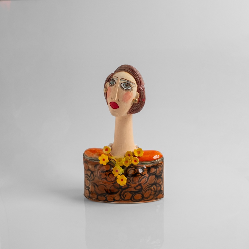 Woman's bust decorated with yellow flowers