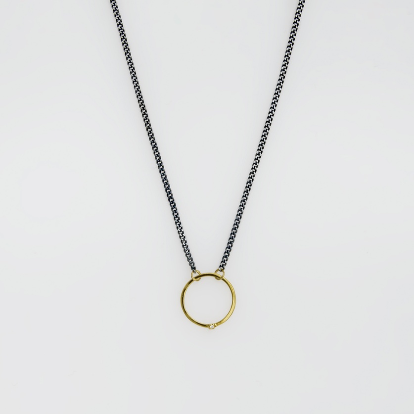 Round gold pendant with brilliant-cut diamond on silver chain (small size)