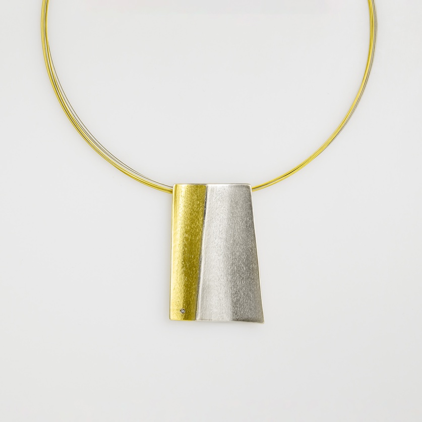 Modern silver necklace with gold inlay and a small diamond