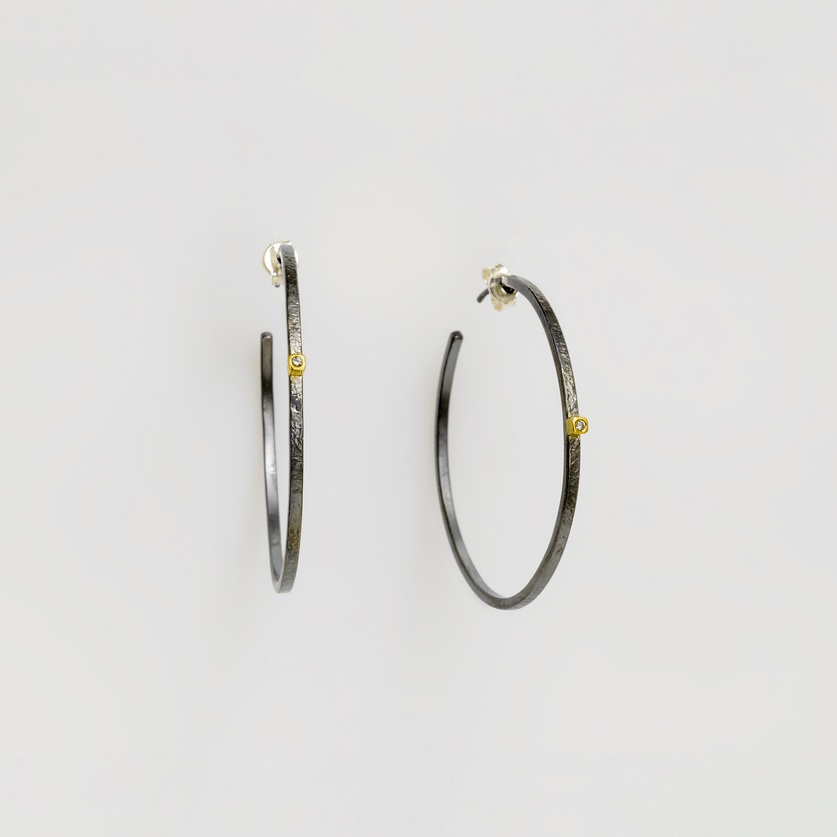 Black silver hoop earrings with bezel set diamonds