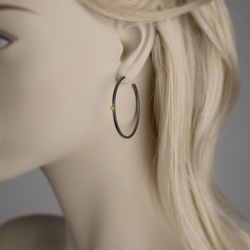 Black silver hoop earrings with bezel set diamonds