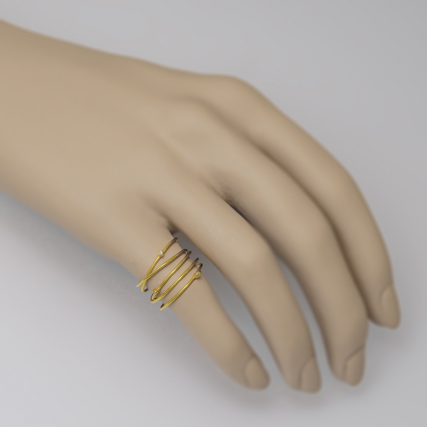 Spiralling ring in K14 gold with three diamonds (medium size)