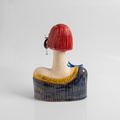 Modern woman with striking earrings and long eyelashes