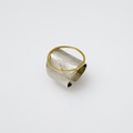 White silver ring of modern design with circle of gold and diamond