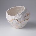 Low porcelain form with gold accents