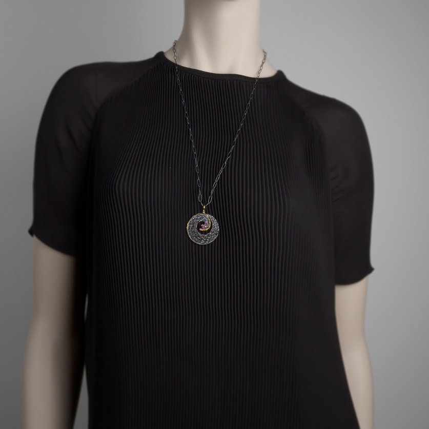 "Wave" pendant in silver, gold inlay and rubies