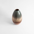 Oval ceramic vase in earthy tones