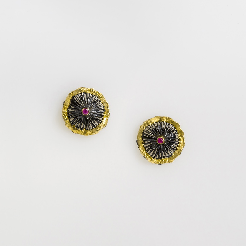 Earrings in silver, gold inlay and rubies