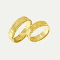 Gold wedding rings with a polished center and diamond-cut edges