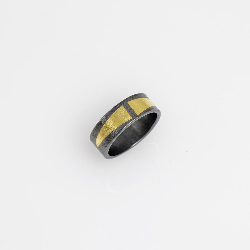 Silver ring with triangles in 22K gold