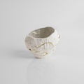 Low porcelain form with gold accents