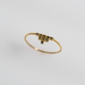 Shiny gold ring with blue diamonds