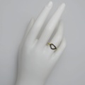 Sleek gold ring with oxidized silver and diamonds