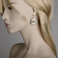 Round silver & gold earrings with garnets
