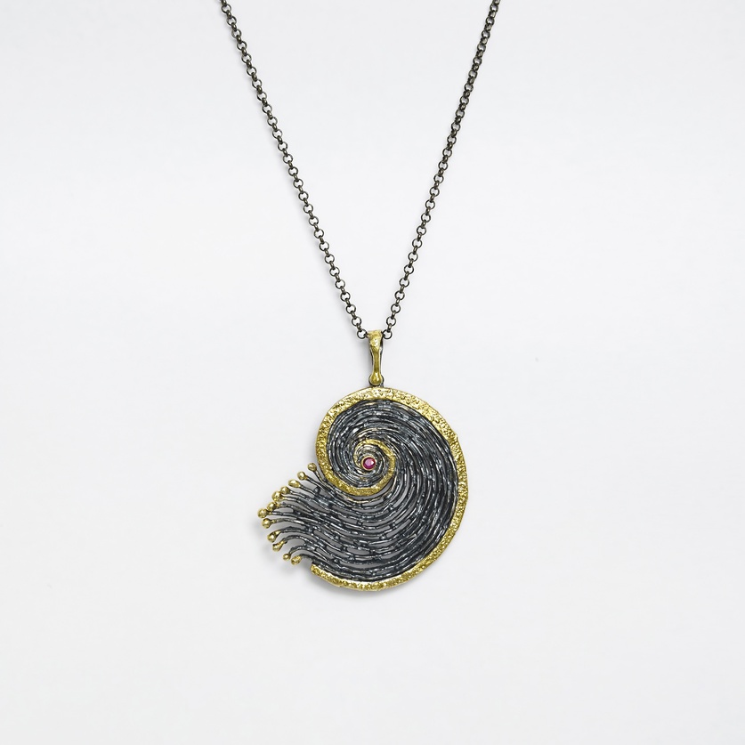 "Shell" silver pendant with gold inlay and small ruby