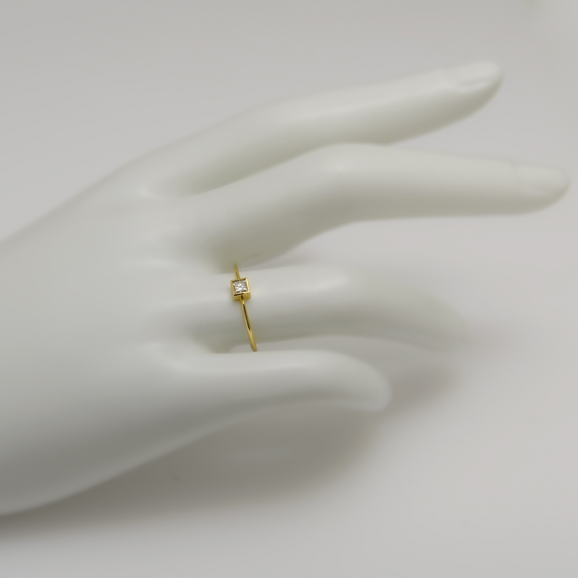 Square gold ring with princess-cut diamond