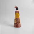 Figurine of an elegantly dressed woman with elaborated style