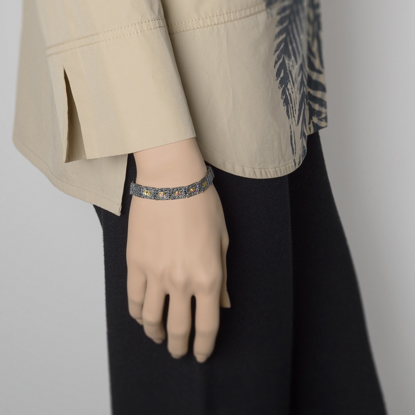 Rough surface bracelet in silver, gold inlay and rubies