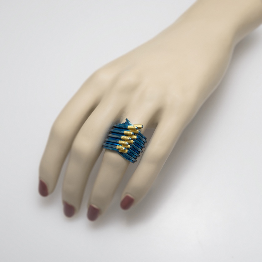 Blue titanium ring of contemporary design with gold (medium size)