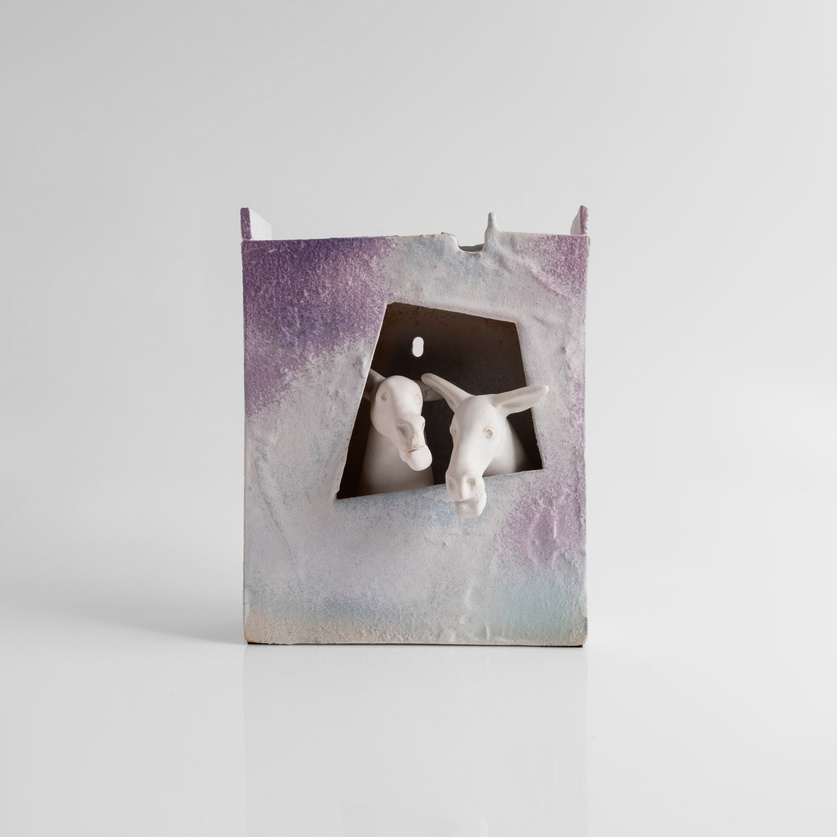 Decorative ceramic composition featuring donkeys