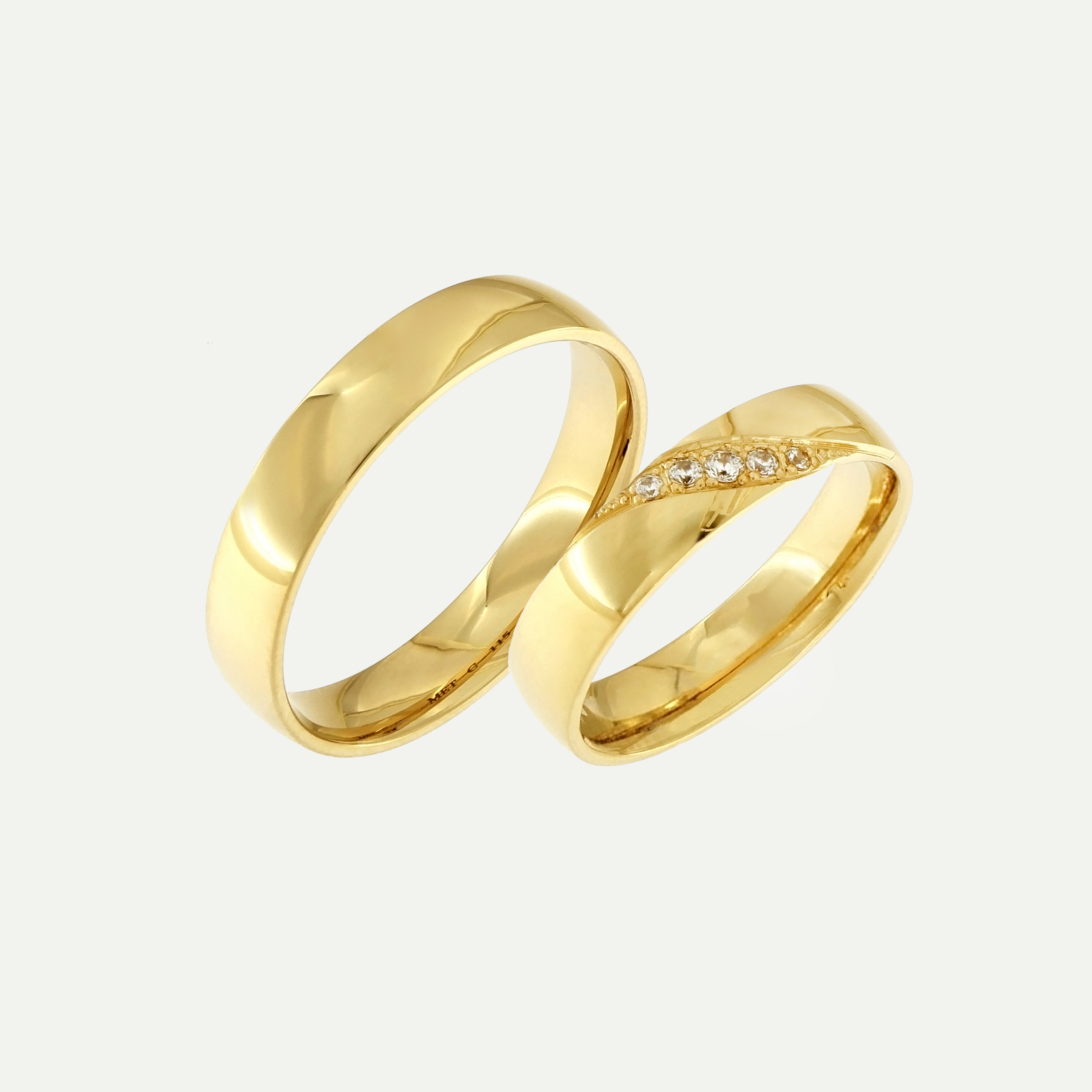 Gold wedding rings with a diagonal row of diamonds